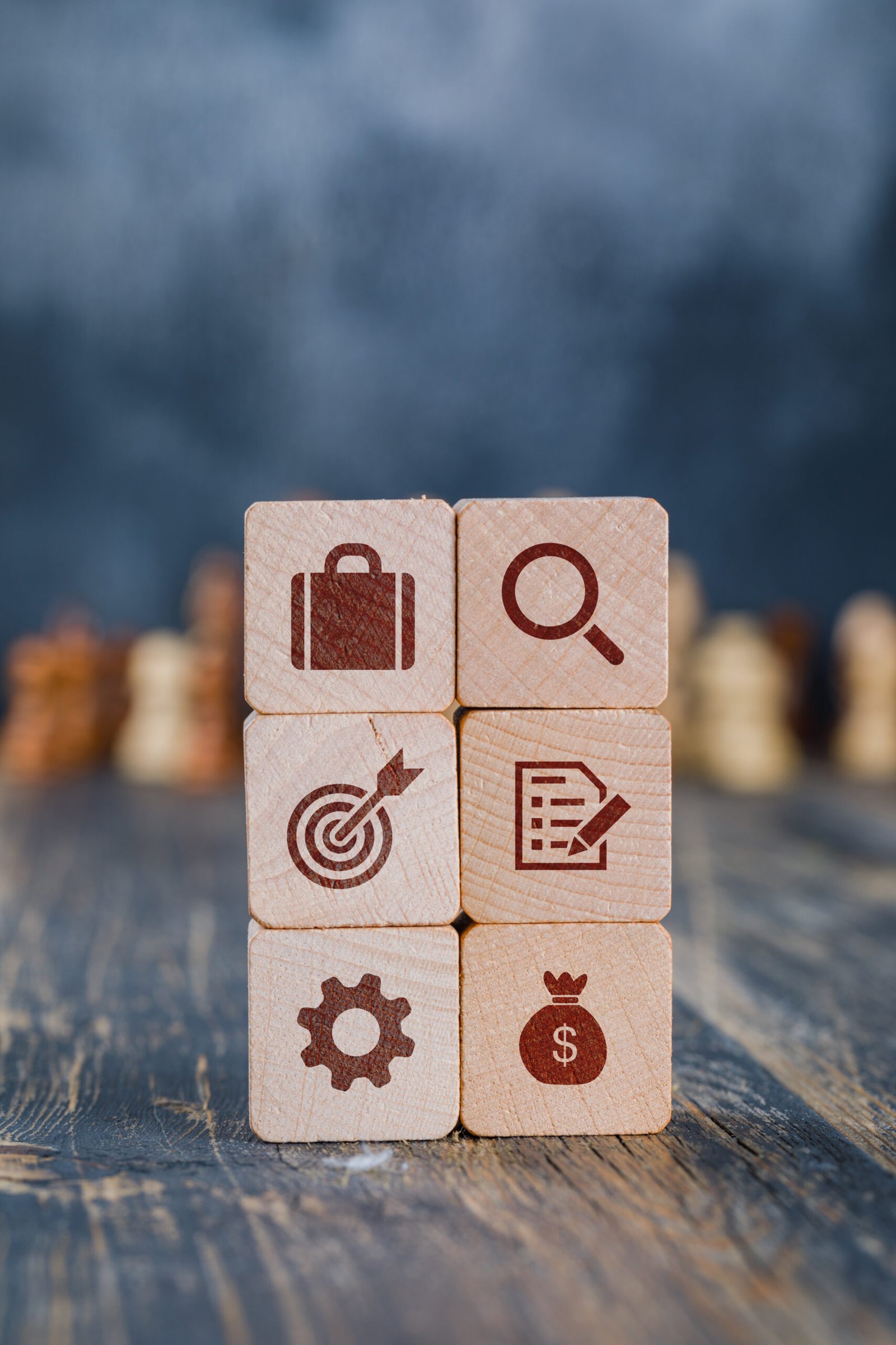 Business strategy concept with wooden cubes, chess figures on gl